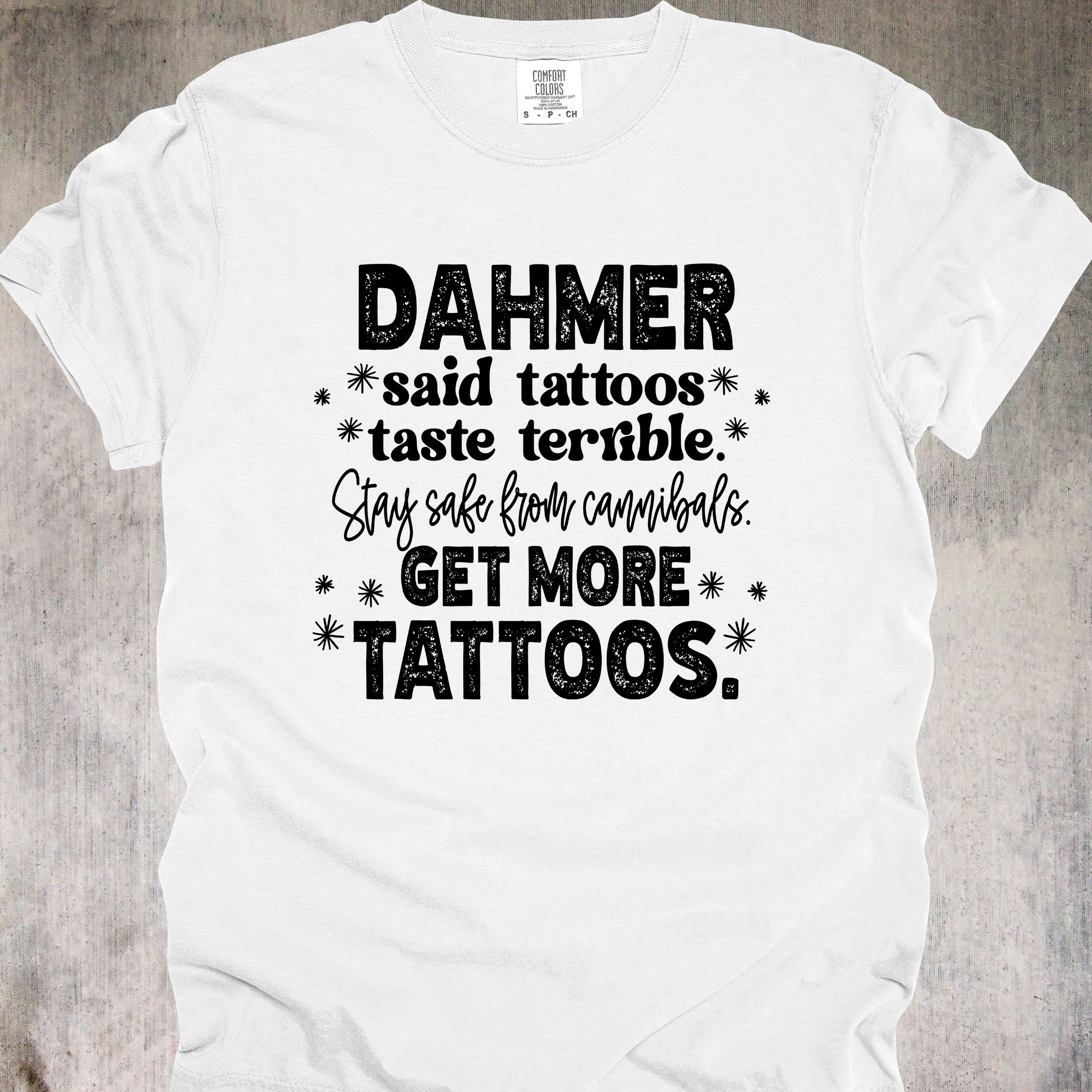 'Dahmer said tattoos taste terrible. Stay safe from canibals. Get more tattoos.' - Unisex Tee - Tattoos: Cannibal-Repellent!