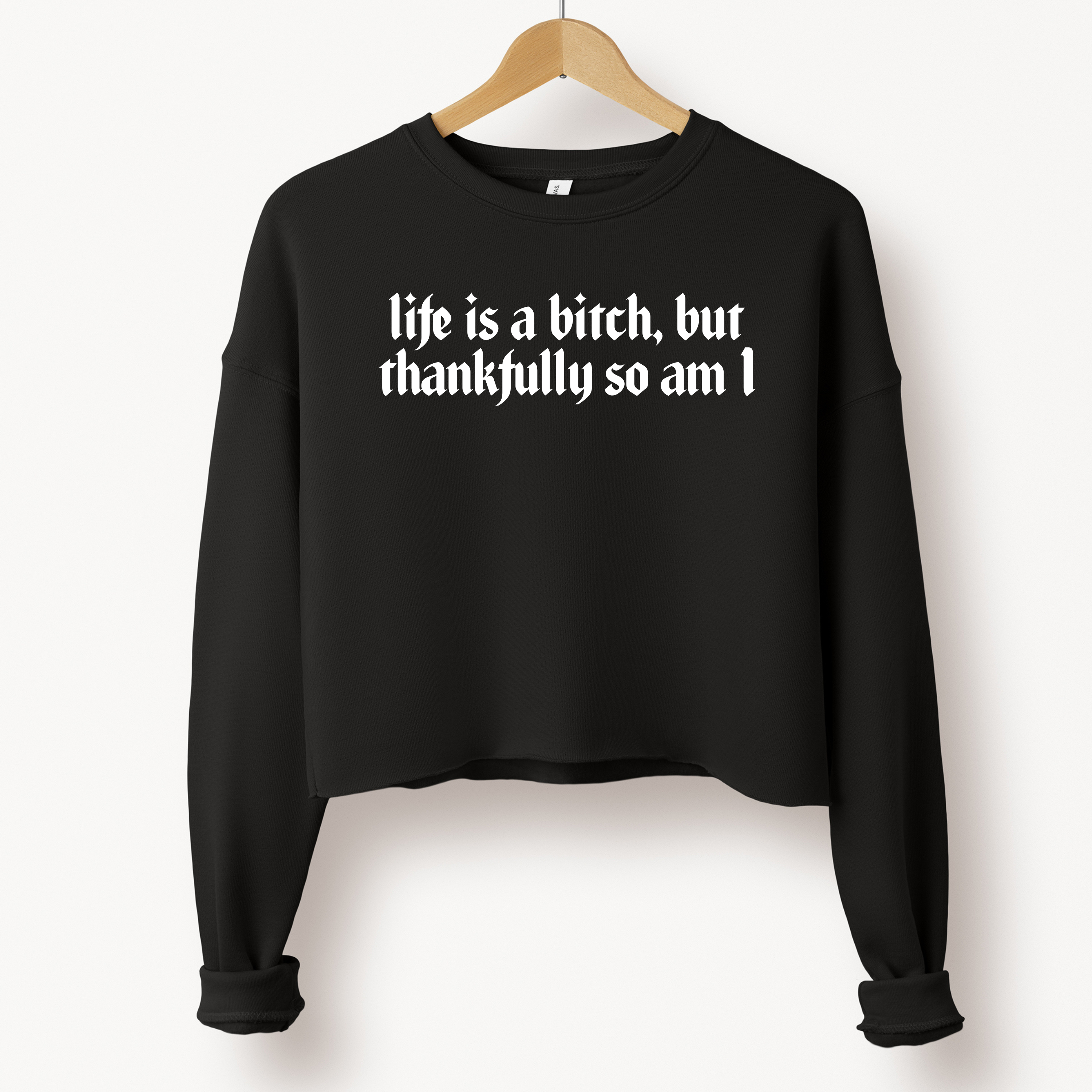 'LIFE IS A BITCH, BUT THANKFULLY SO AM I' - Cropped Fleece Sweatshirt