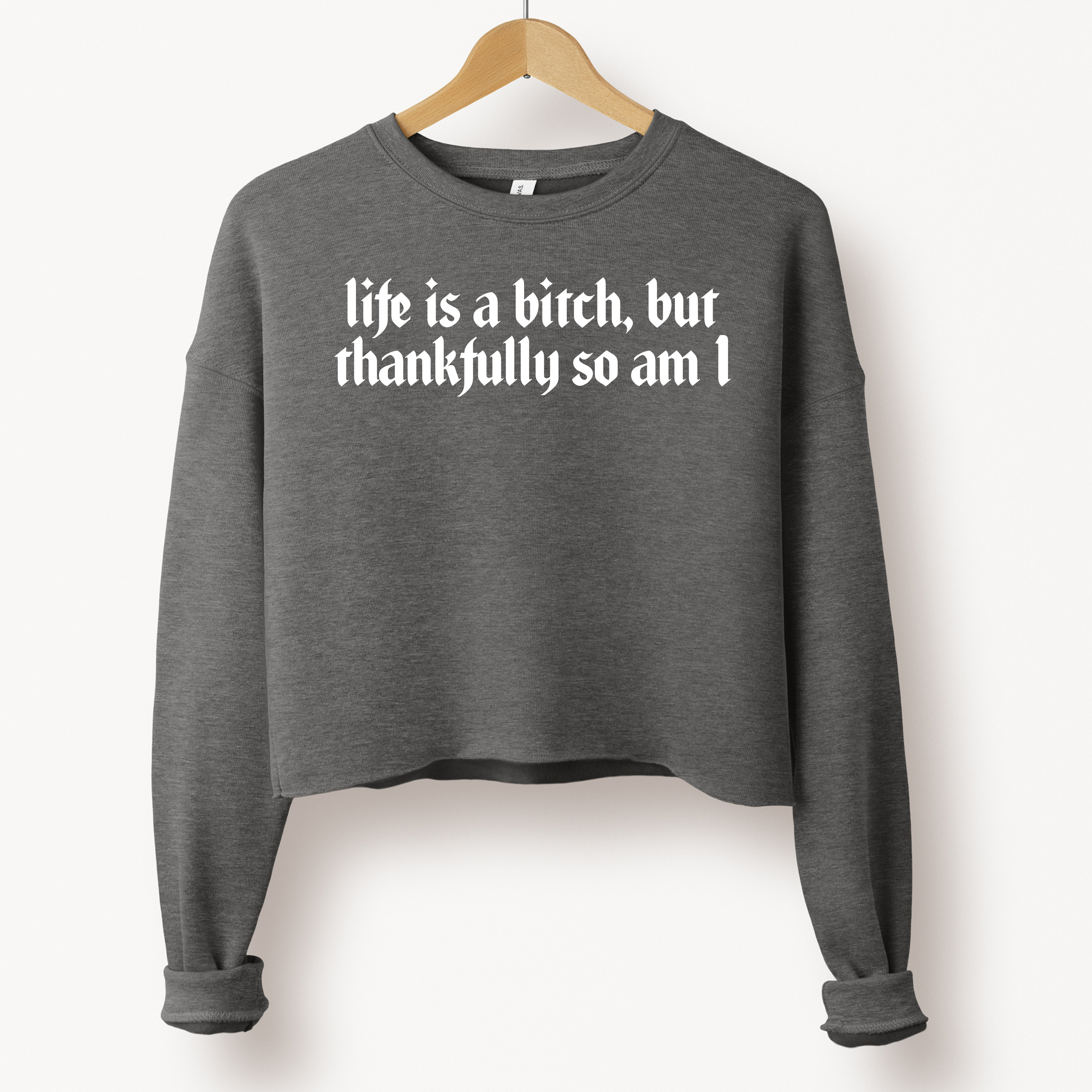 'LIFE IS A BITCH, BUT THANKFULLY SO AM I' - Cropped Fleece Sweatshirt